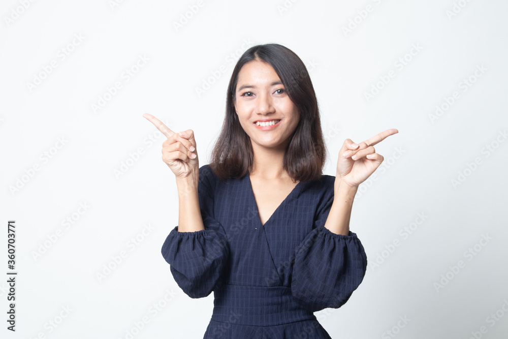 Young Asian woman point to left and right. Young Asian woman point to left and right.