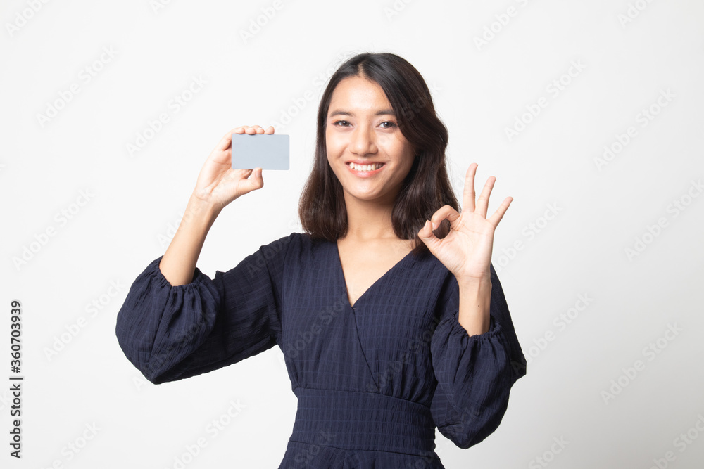 Young Asian woman show OK with a blank card. Young Asian woman show OK with a blank card.