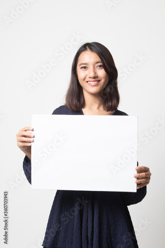 Young Asian woman with white blank sign.