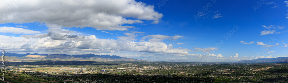 Salt Lake Valley pano during COVID 19 isolation looking west and north with clouds and blue sky