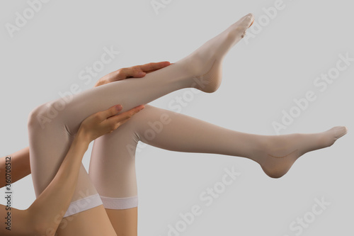 Compression stockings in grey background