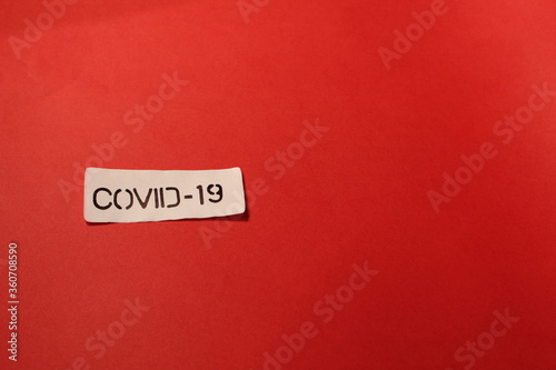 COVID-19 label on a red background