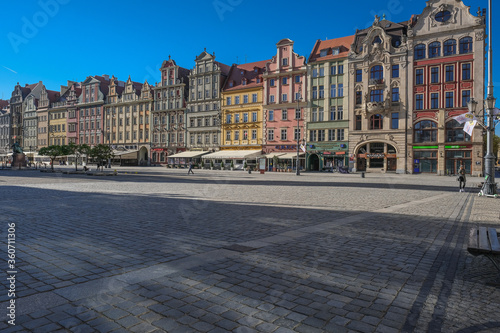 Market Square, Wroclaw, Poland - April 21, 2019: Central square in Wroclaw Old Town since the Middle Ages, surrounded by ornamented and colorful frontages of historical tenement houses.