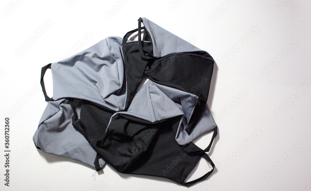 face mask in grey. Five masks to personal wear. White background. It avoids contagious disease face mask in grey. Five masks to personal wear. White background. It avoids contagious disease