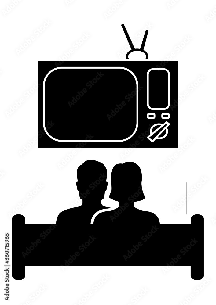 Man and woman watching TV while sitting on a sofa. Married couple. Home