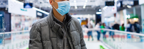 Man wearing mask for protect Novel Coronavirus:2019 or PM 2.5 dust and serious of the air pollution in department store.