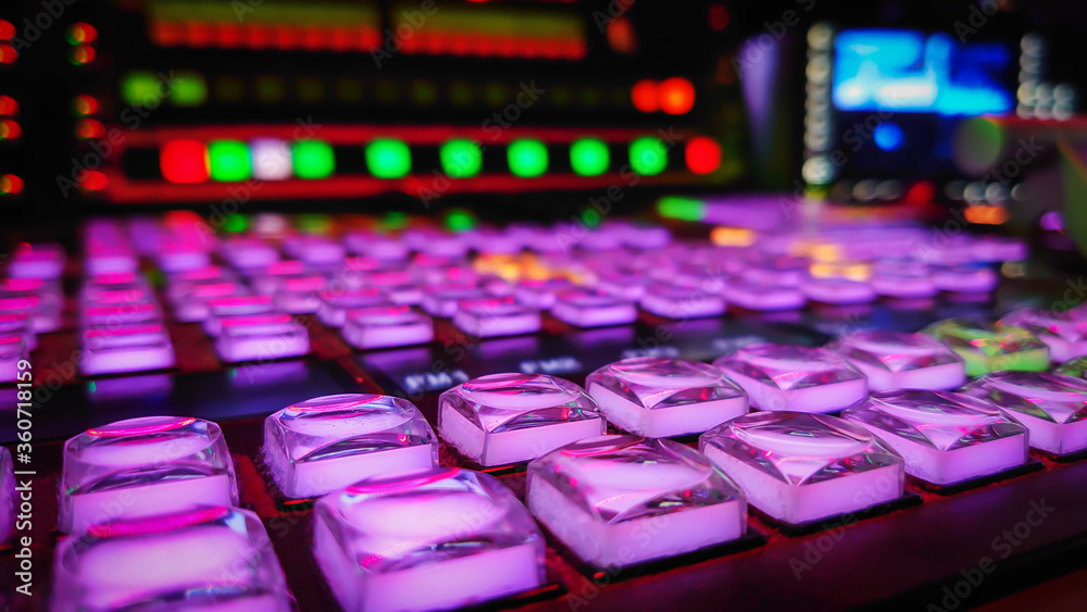 A close-up of an video mixer in a tv station