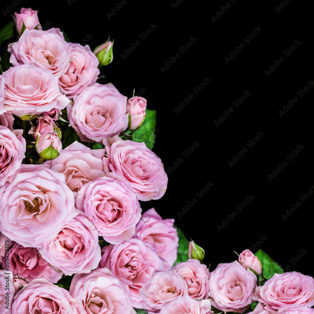 Beautiful Roses Bouquet. Pink Flowers on black background. Holiday concept, Greeting card, top view, flat lay, copy space for text