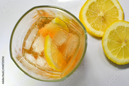 Refreshing light delicious summer aperol cocktail with ice and lemon in a glass isolated on white