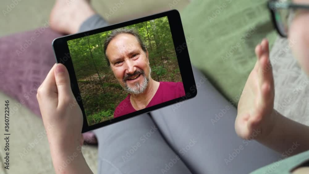 Young woman having video call via tablet talking to dad. Friends, facetime, online, internet, long distance communication, chatting concept. skype chatting with father.