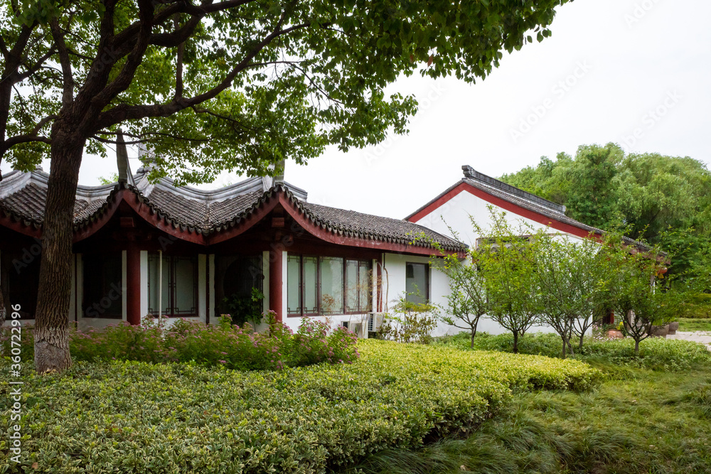 Chinese architecture between trees in South Lake scenic area in Jiaxing, China