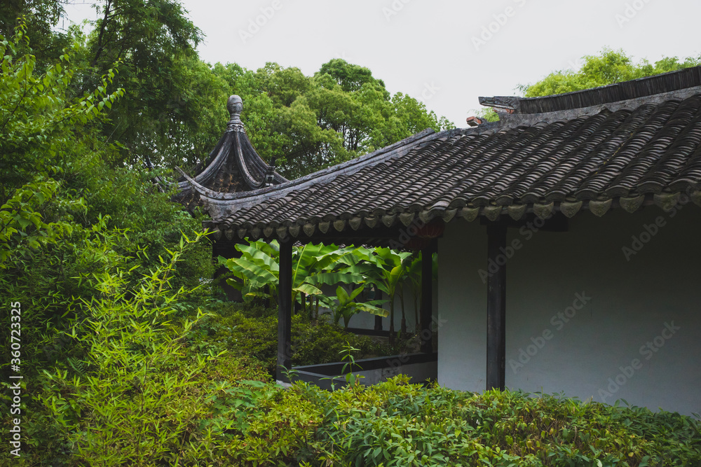 Chinese architecture between trees in South Lake scenic area in Jiaxing, China Chinese architecture between trees in South Lake scenic area in Jiaxing, China
