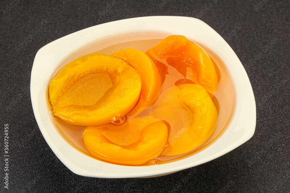 Marinated peaches fruit in the bowl Marinated peaches fruit in the bowl
