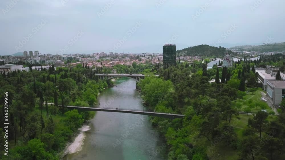 Footbridge on the Moraca River in Podgorica (City panorama), Montenegro Footbridge on the Moraca River in Podgorica (City panorama), Montenegro