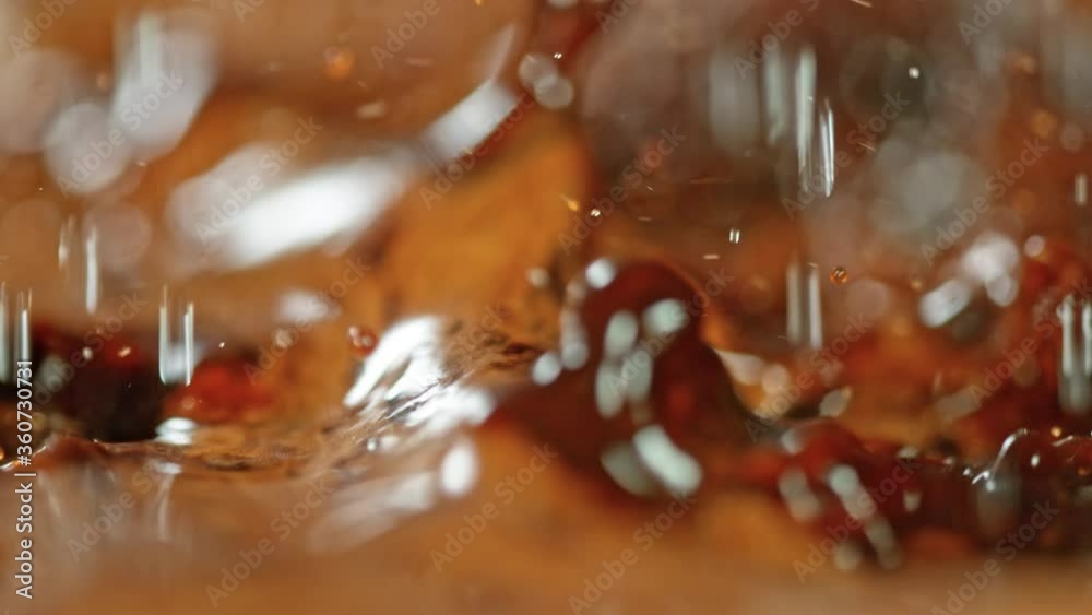Super Slow Motion Macro Shot of Splashing Fresh Coffee and Water Droplets at 1000 fps. Super Slow Motion Macro Shot of Splashing Fresh Coffee and Water Droplets at 1000 fps.
