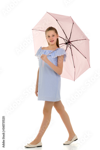 Pretty Teen Girl Walking under Pink Umbrella Against White Backg