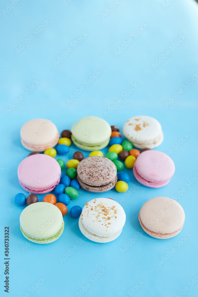 pasta cookies on a blue background and colored pills pasta cookies on a blue background and colored pills