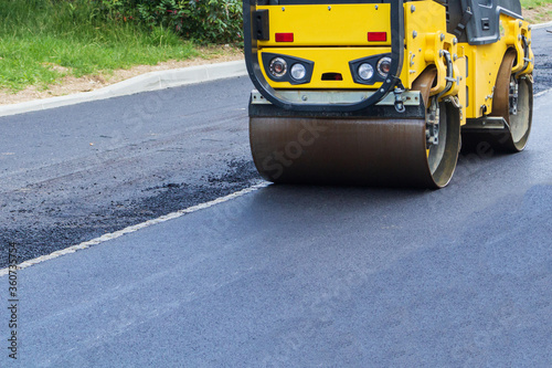 Fresh black asphalt on new street road. Construction at work.