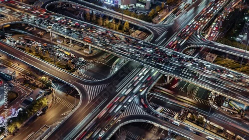 TL/ZI Asia, China, Beijing, Aerial view Zoom In Time lapse of busy road intersection in Beijing's financial district, with  traffic and commuters during evening rush hour
