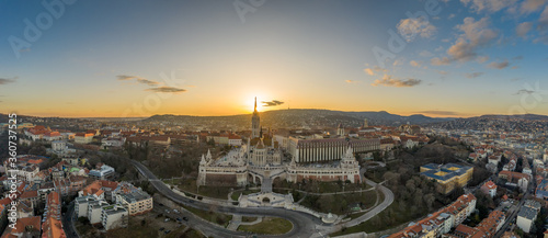 Aerial panorama drone shot of Matthias Church Fisherman's Bastion on Buda Hill in Budapest sunset