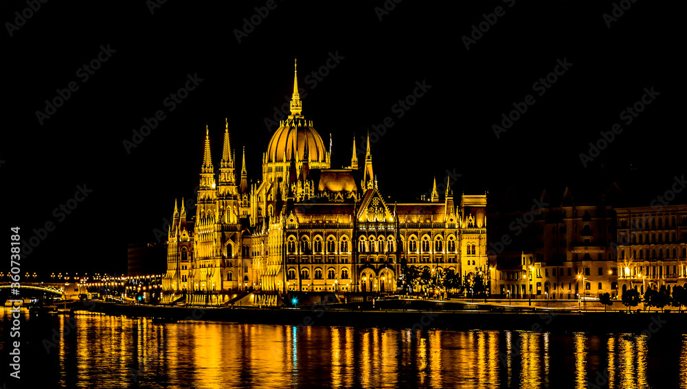A view of the illuminated eastern shore of the River Danube in Budapest at night in the summertime