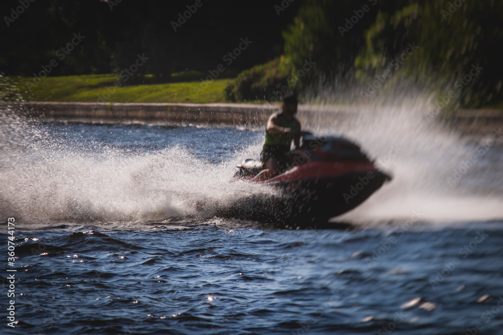 Obraz premium View of jet ski in motion, group of jet skiers with a big water splash