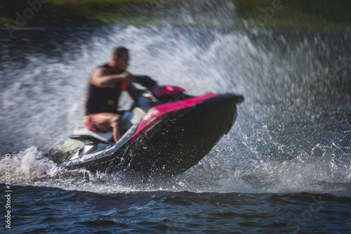 View of jet ski in motion, group of jet skiers with a big water splash