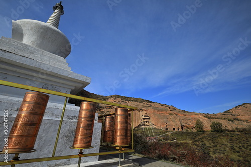 White stupa-blue sky-cirrus clouds-copper prayer wheels. Mati si-Horse Hoof Temple-Zhangye-Gansu-China-0960 photo