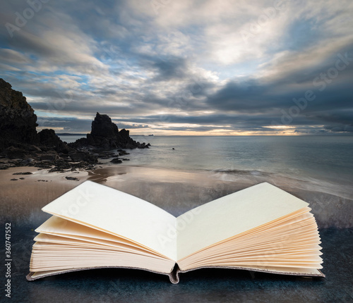 Digital composite concept image of open book wth Stunning, vibrant sunrise landscape image of Barafundle Bay on Pembrokeshire Coast in Wales photo