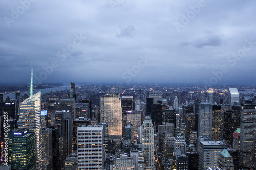 Illuminated New York skyline with skyscrapers seen from an aerial view