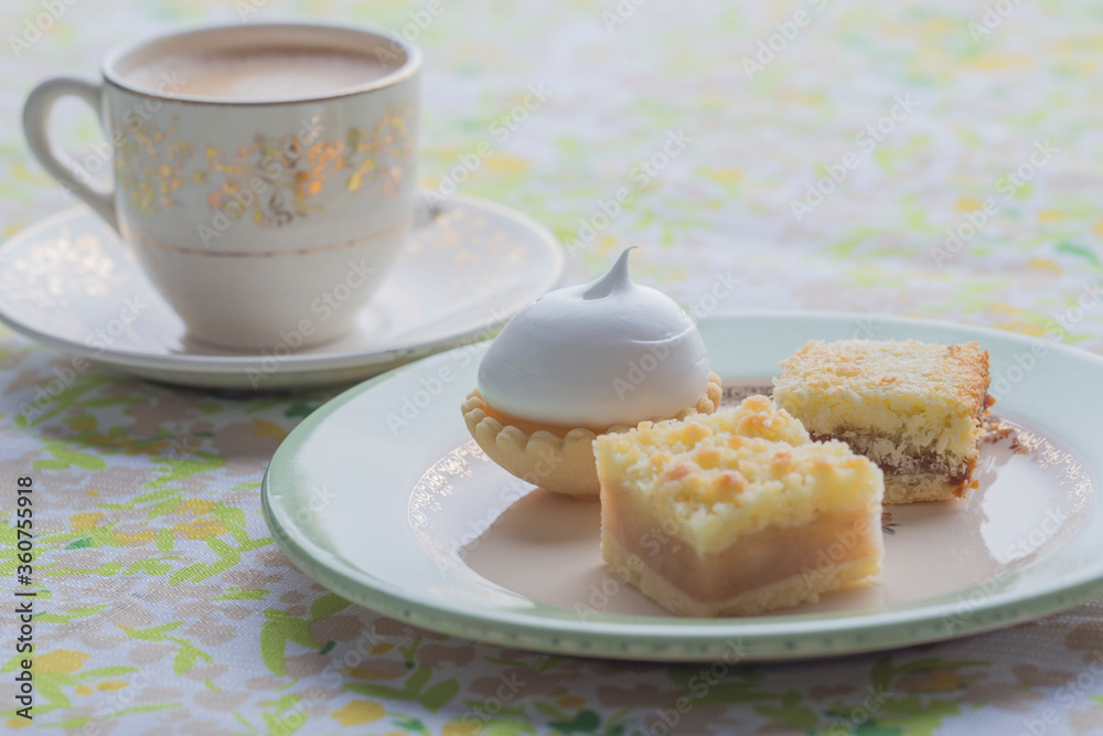 Breakfast with coffe and delicious petit cakes Breakfast with coffe and delicious petit cakes