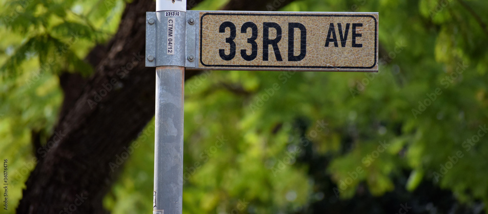 Thirty Third/33rd Avenue road sign/street name