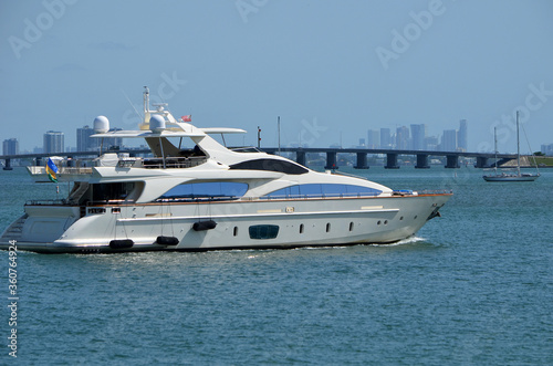 White motor yacht slowly cruising on the Florida Intra-Coastal Waterway off Miami Beach.