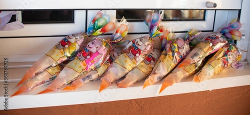 Panoramic shot of colorful candy bags on a windowsill photo