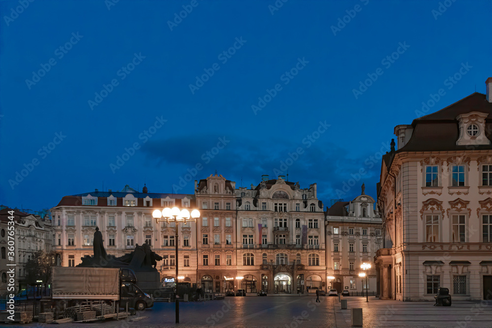 Deserted Prague Old Town Square at sunrise lone figure in distance nobody