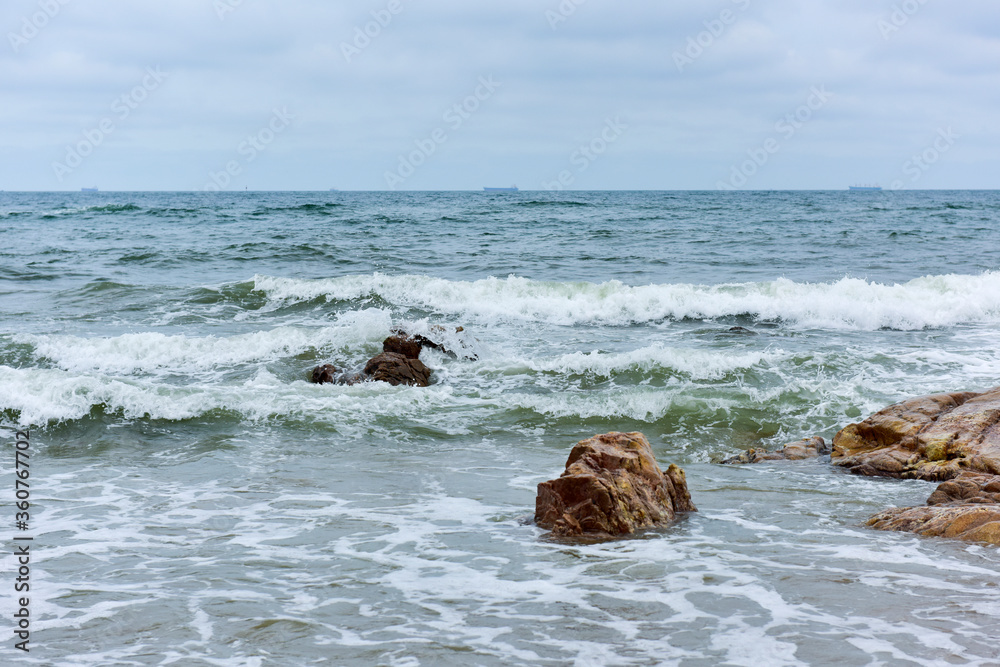 Coastline in the background of dark clouds