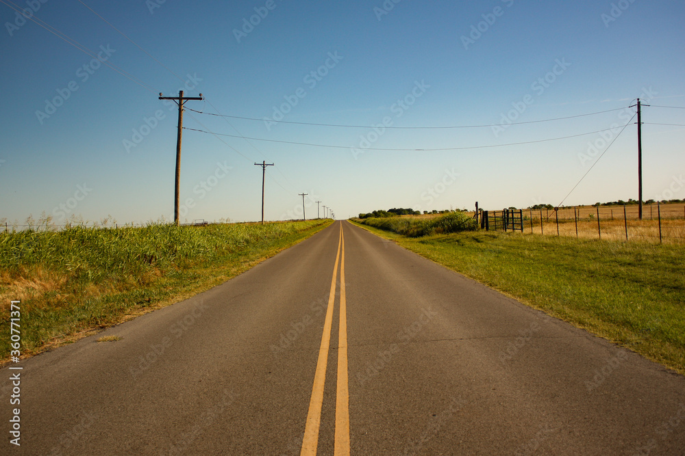Long Rural Road Through Farmland in Oklahoma Long Rural Road Through Farmland in Oklahoma