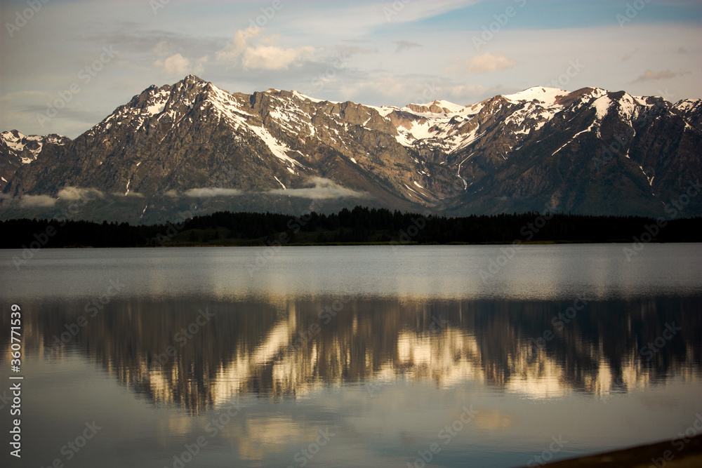 Grand Tetons Mountain Range Reflected in a Lake at Sunrise