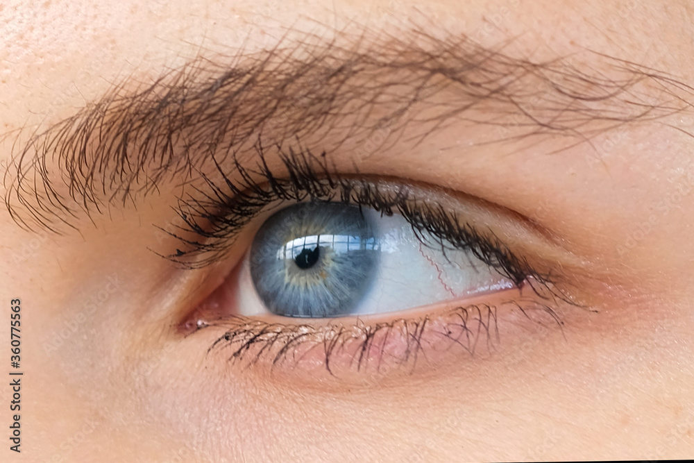 The woman's eyes, she has beautiful blue artificial eyes. The woman's eyes, she has beautiful blue artificial eyes.