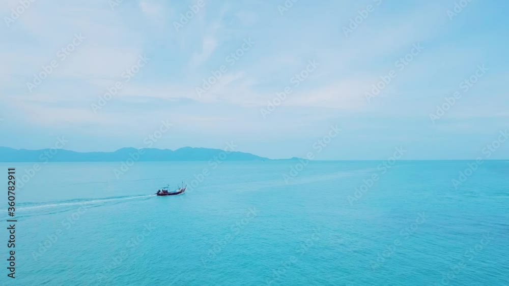 Aerial view boat floating on the pristine water from koh samui island,thailand Aerial view boat floating on the pristine water from koh samui island,thailand
