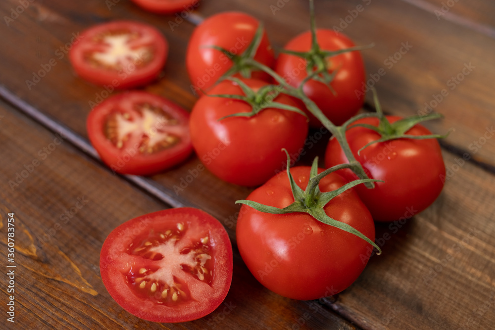 tomato on a brown wooden background, top view, text space, fresh vegetables tomato on a brown wooden background, top view, text space, fresh vegetables