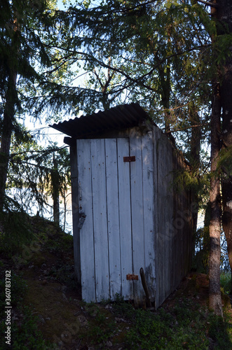 Wooden toilet hut in the forest. Norway