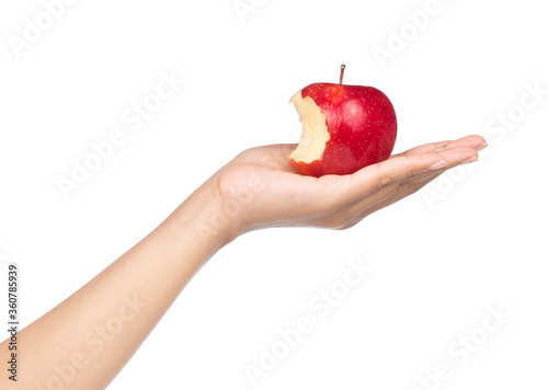 hand holding bite red apple isolated on white background