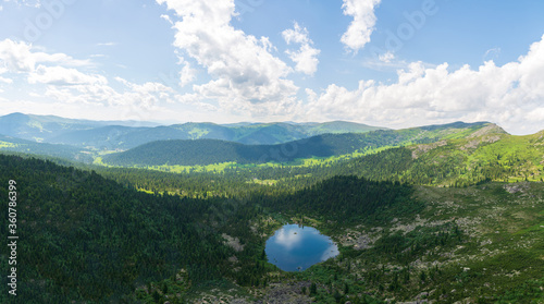Ergaki Park. Rainbow Lake. A view of the Lake, forest and mountains from a bird's eye view.