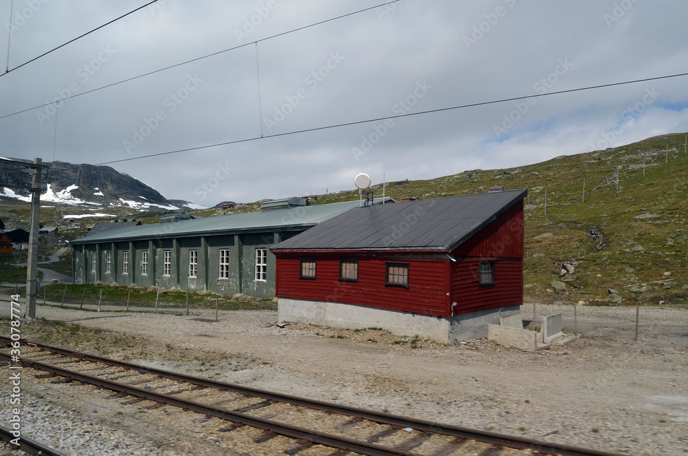 Obraz premium Views from the train window. Mountain tundra of Central Norway. Railway travel in Norway.The Bergen - Oslo train.