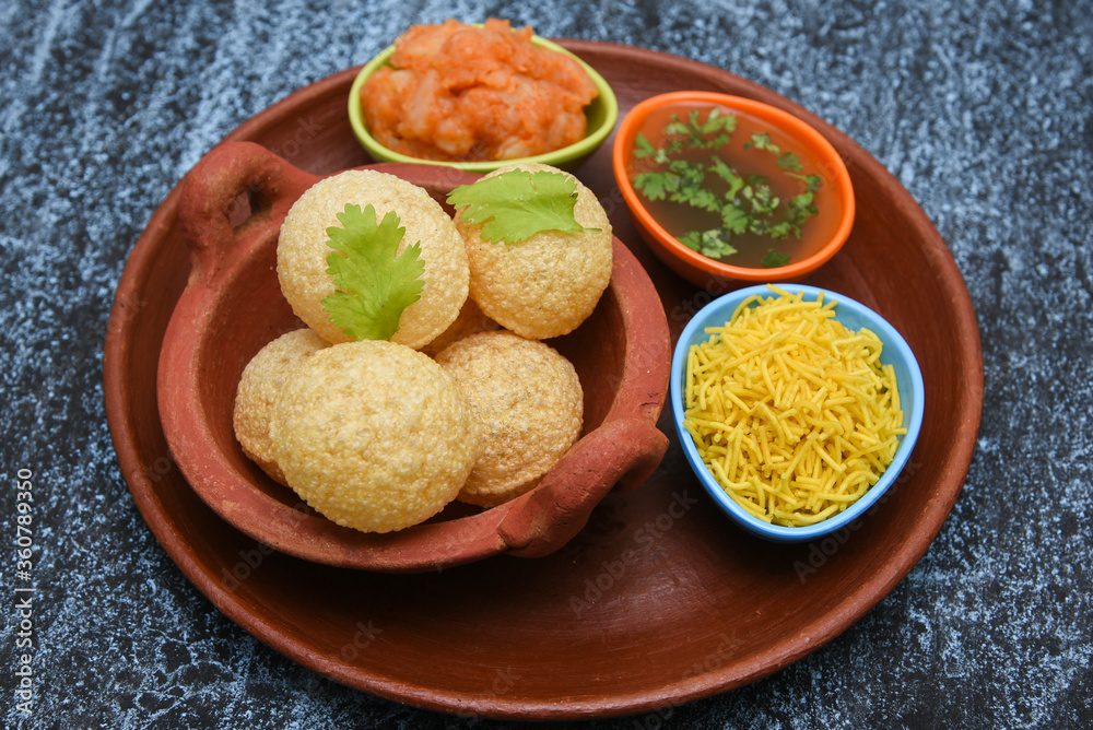 Spicy Pani puri golgappe and potato stuffing, Chat item, India. panipuri, North Indian street food snack served with tangy tamarind water, chaat masala, chickpeas Delhi, Mumbai, Rajasthan, Bangalore Spicy Pani puri golgappe and potato stuffing, Chat item, India. panipuri, North Indian street food snack served with tangy tamarind water, chaat masala, chickpeas Delhi, Mumbai, Rajasthan, Bangalore