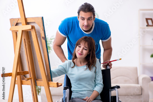 Disabled wife and young husband at home