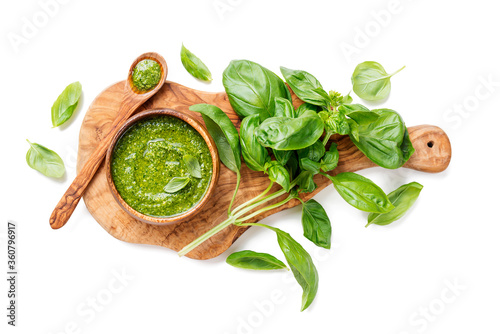 Fotografie, Obraz Traditional italian sauce pesto with green basil in wooden bowl isolated on whit