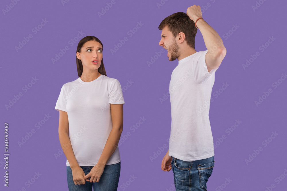 Young man arguing with his girlfriend who afraid of him Young man arguing with his girlfriend who afraid of him