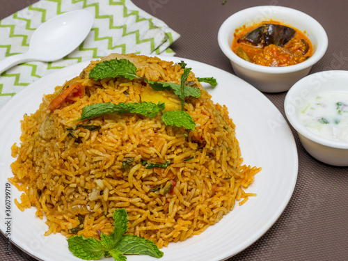 Chicken Biryani is a savory chicken and rice dish that includes layers of chicken, rice, and aromatics that are steamed together